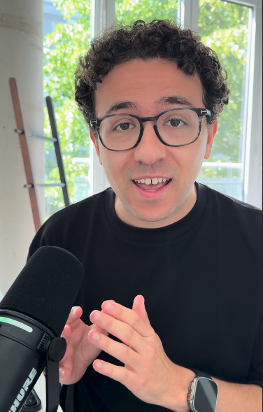 Jake Rosenthal with a microphone